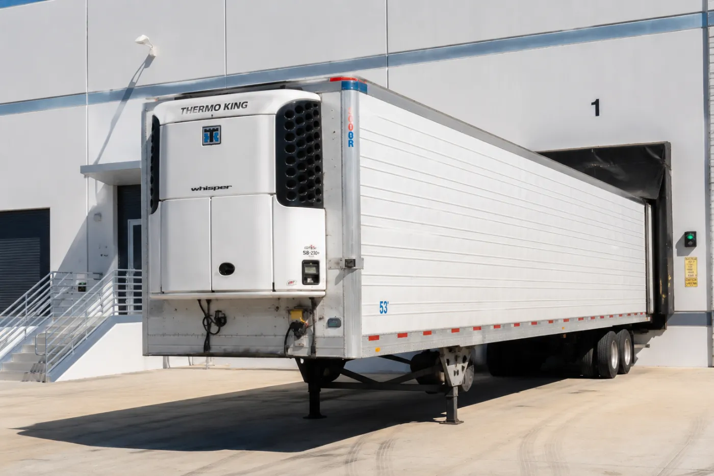 OnTrak genset-powered chassis hauling a refrigerated reefer container from a Florida port terminal